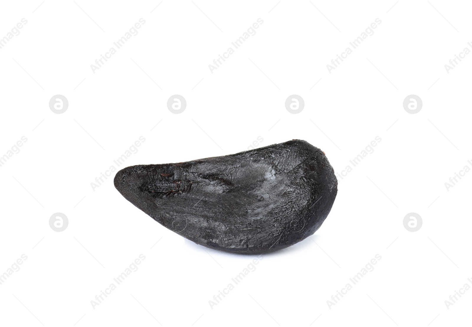 Photo of Clove of aged black garlic on white background