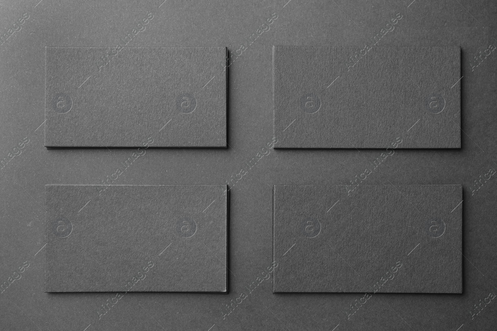 Photo of Blank business cards on black background, flat lay. Mockup for design