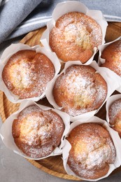 Photo of Delicious muffins on grey table, top view