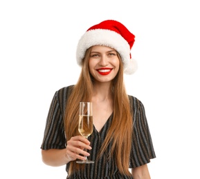 Photo of Young beautiful woman in Santa hat with glass of champagne on white background. Christmas celebration