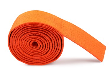 Photo of Orange karate belt isolated on white. Martial arts uniform