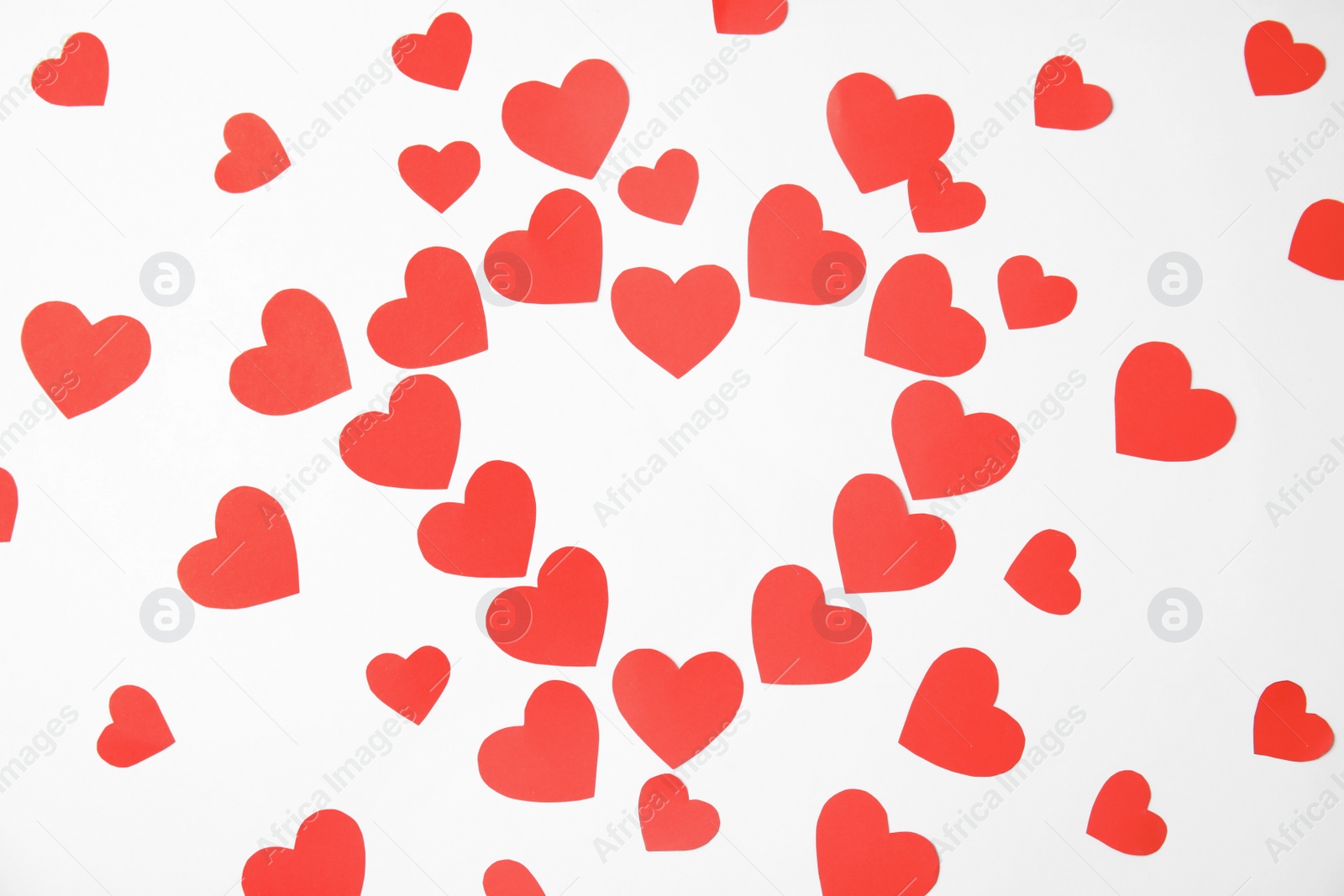 Photo of Composition made of small paper hearts on white background