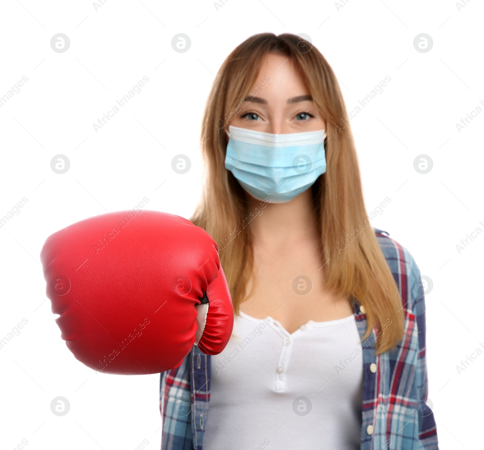 Photo of Woman with protective mask and boxing gloves on white background. Strong immunity concept