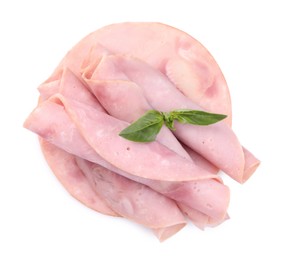 Rolled slices of tasty ham and basil isolated on white, top view