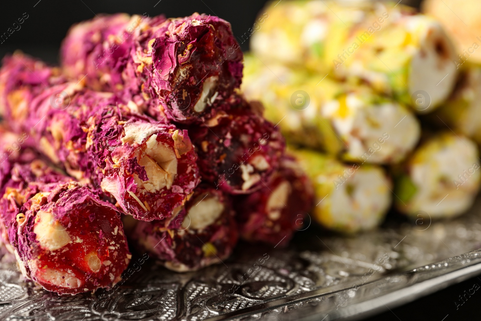 Photo of Turkish delight dessert on tray, closeup. Traditional sweet