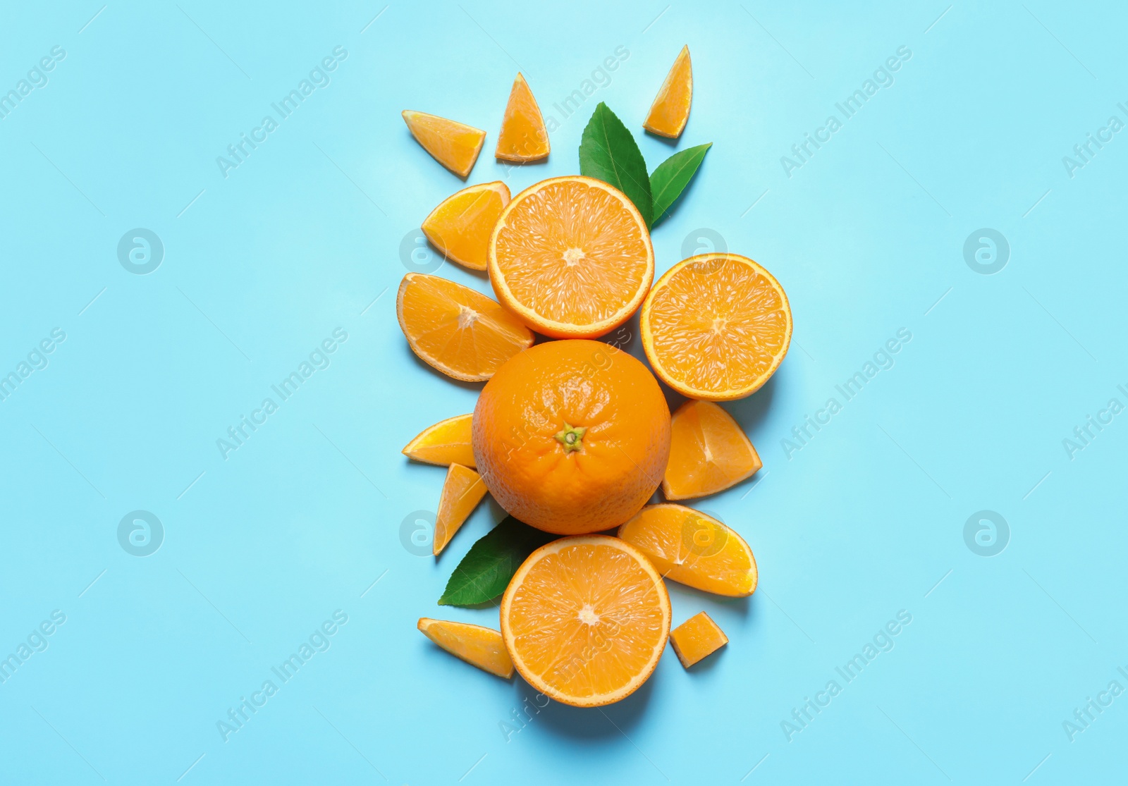 Photo of Flat lay composition with ripe oranges on color background