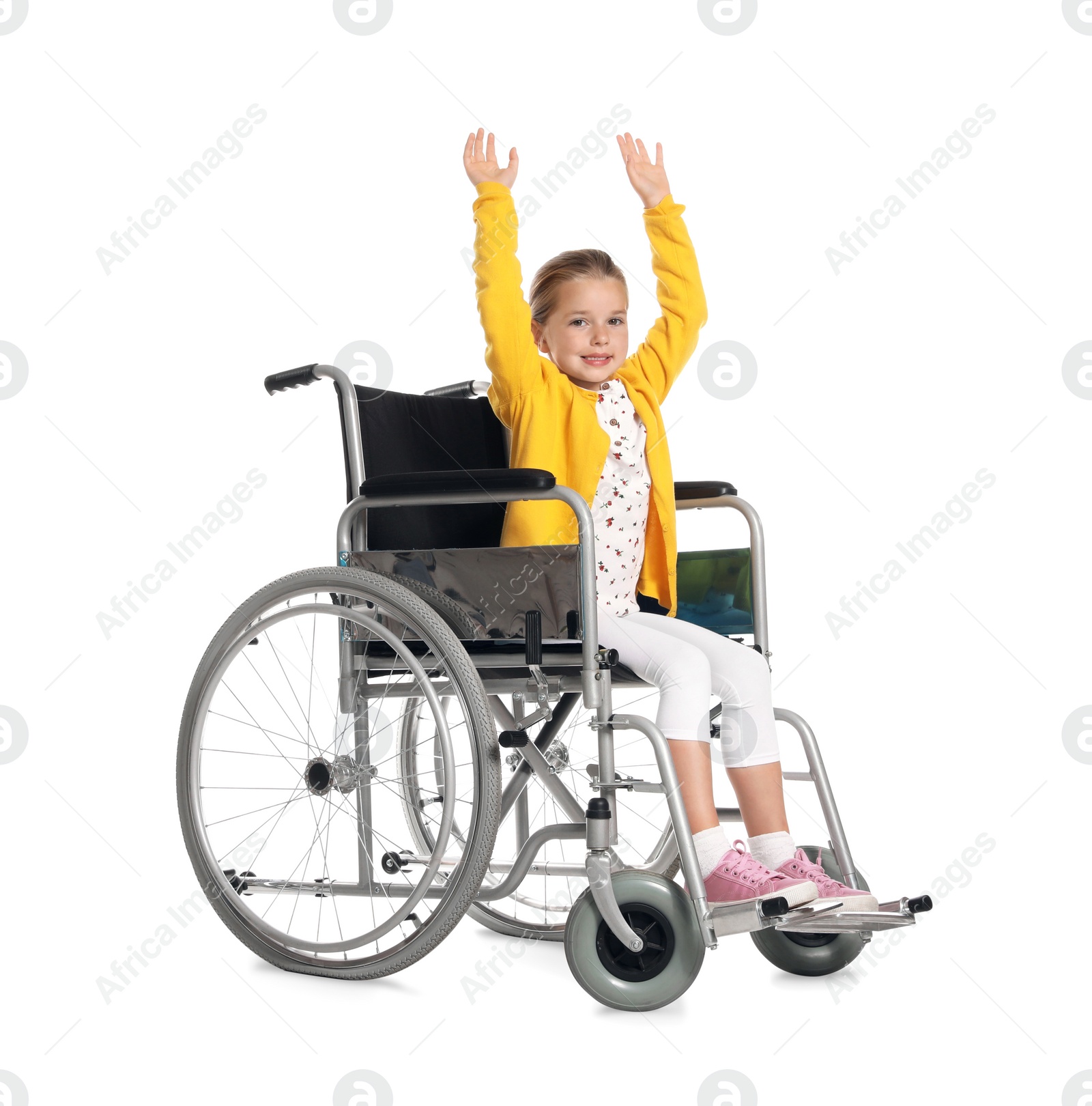 Photo of Little girl in wheelchair on white background