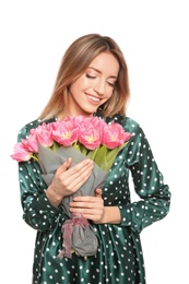 Photo of Portrait of smiling young girl with beautiful tulips on white background. International Women's Day