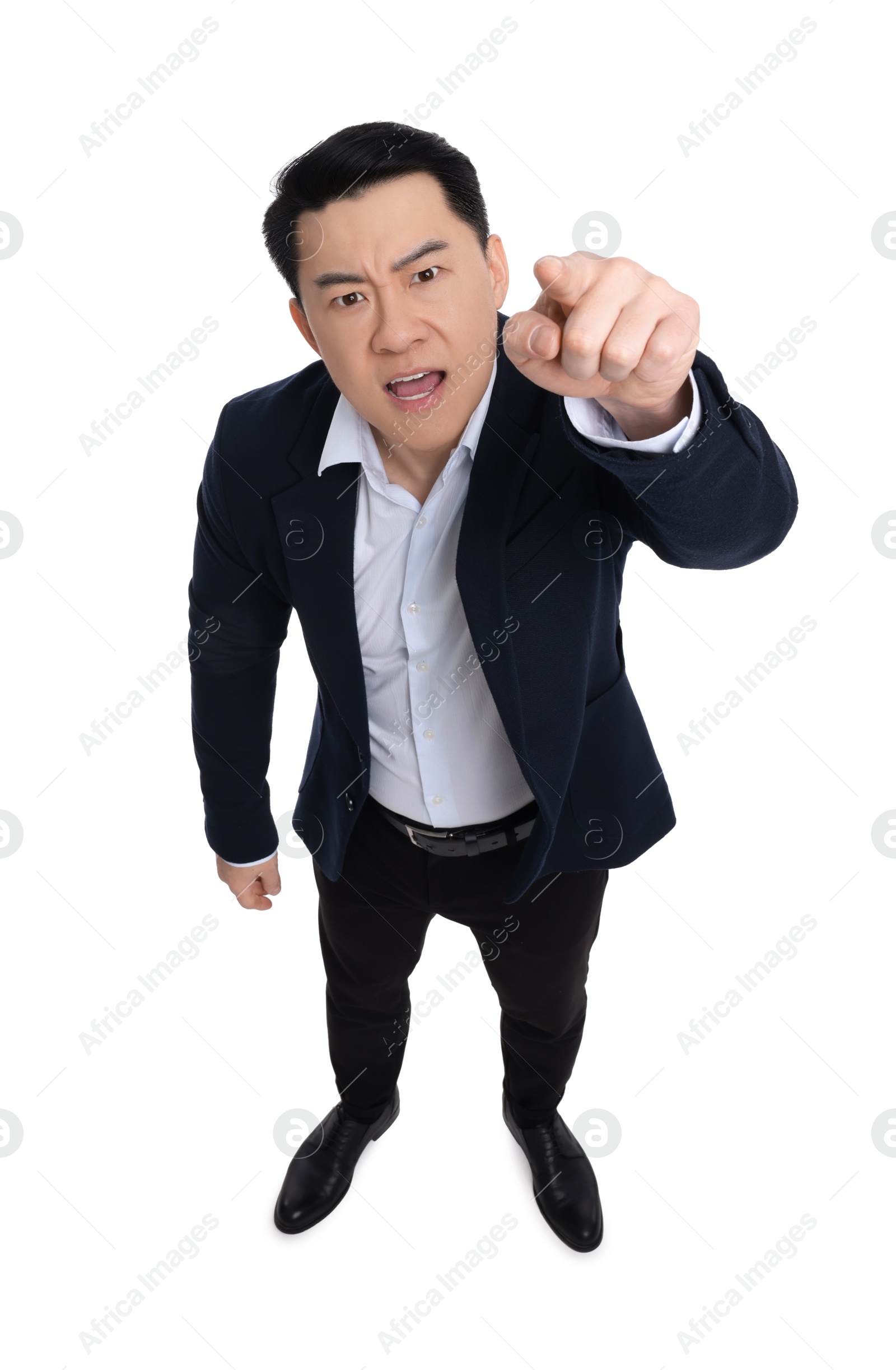 Photo of Angry businessman in suit posing on white background, above view