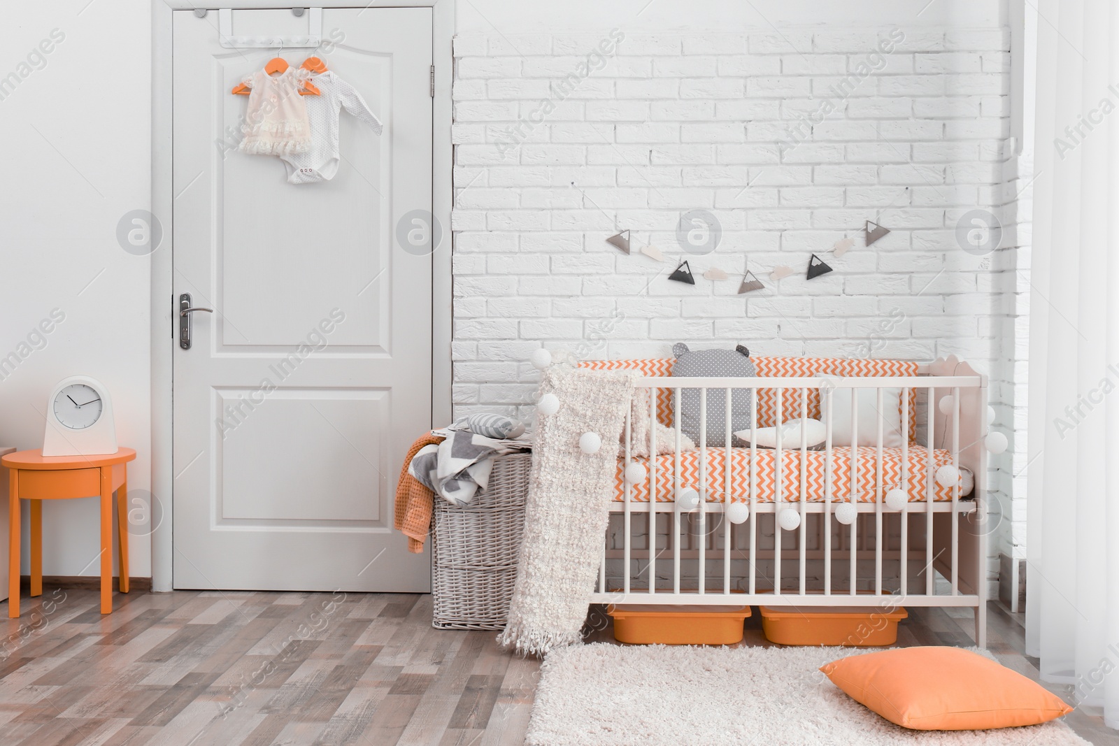 Photo of Stylish baby room interior with crib