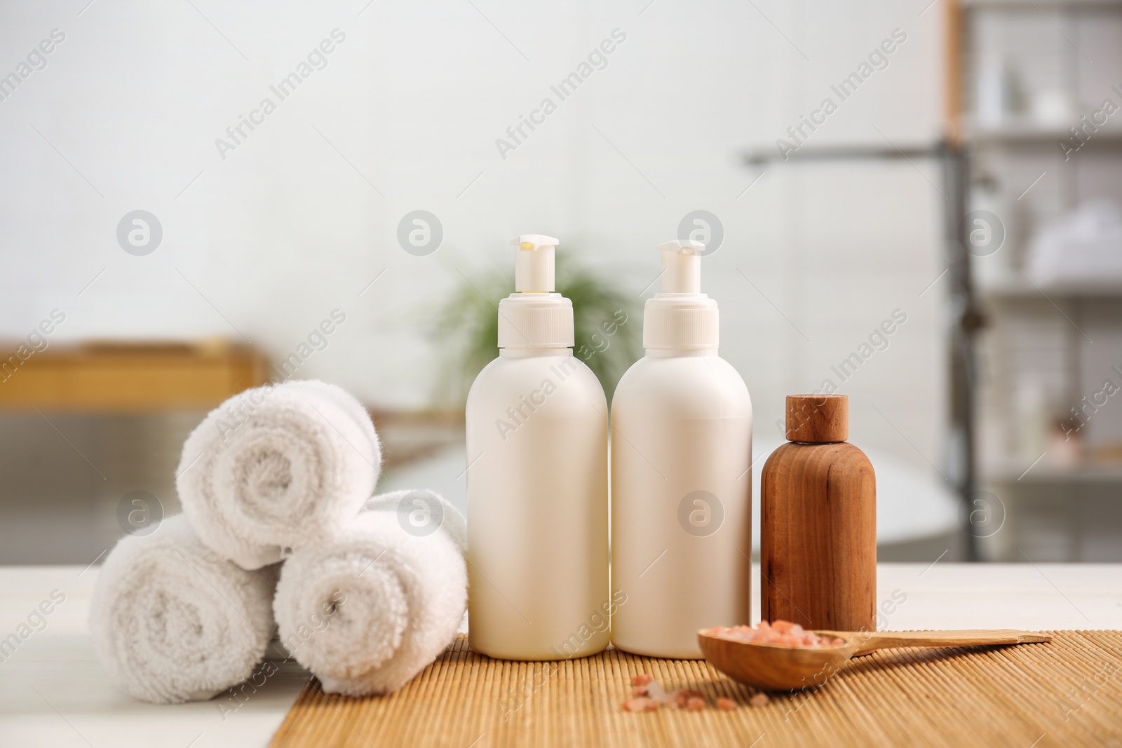 Photo of Composition with spa products on white table in bathroom