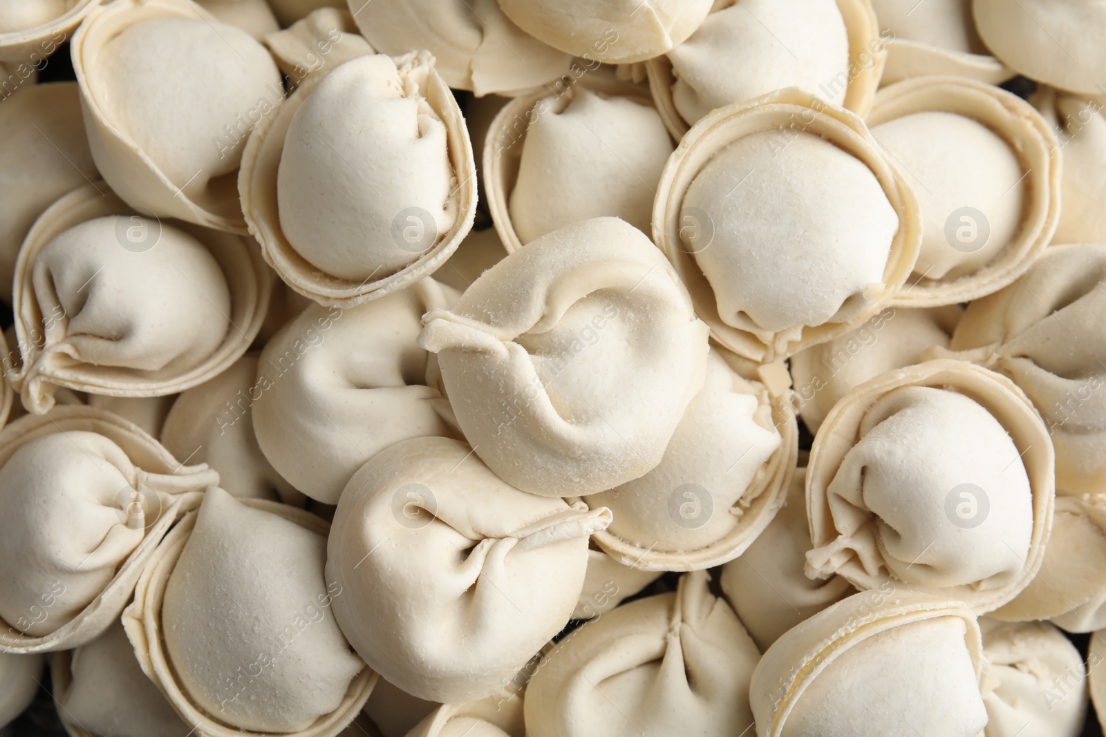 Photo of Raw dumplings as background, top view. Home cooking