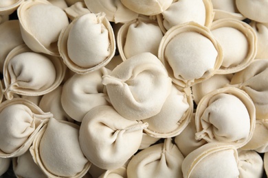 Photo of Raw dumplings as background, top view. Home cooking