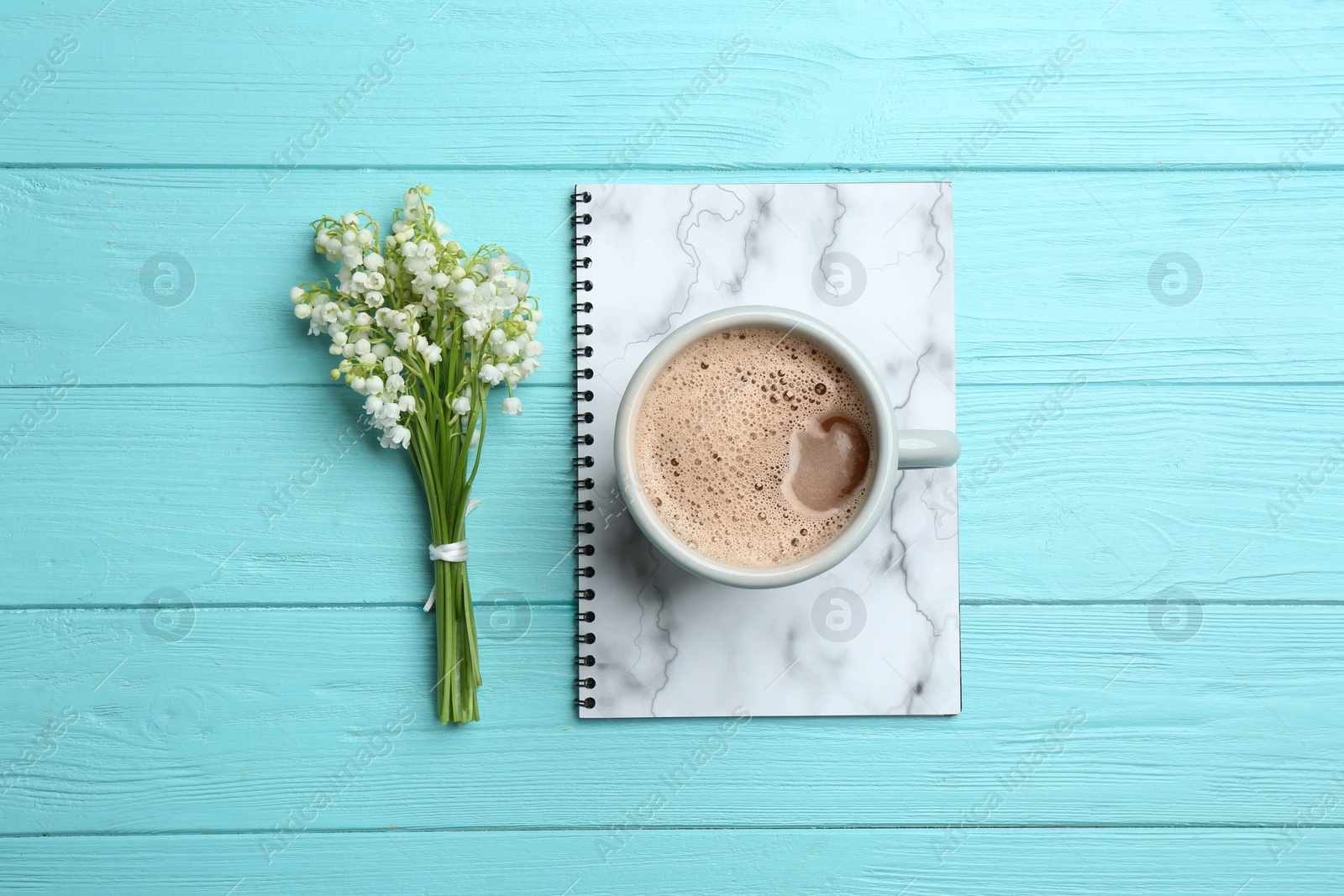 Photo of Flat lay composition with notebook, lily of the valley bouquet and coffee on wooden background