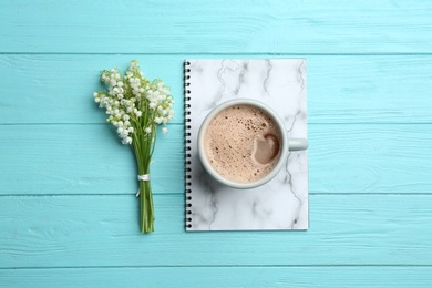 Photo of Flat lay composition with notebook, lily of the valley bouquet and coffee on wooden background