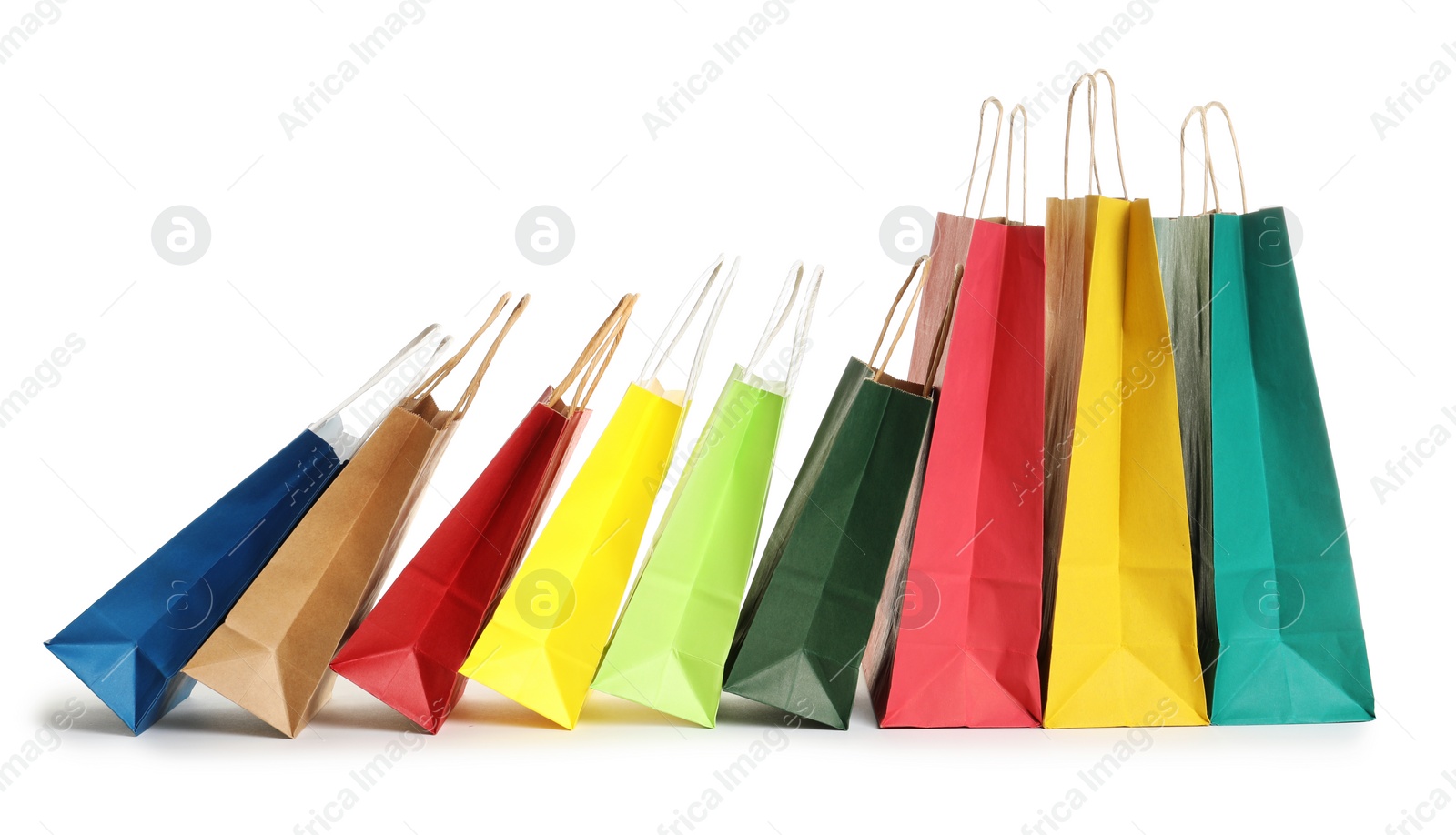 Photo of Colorful paper shopping bags on white background