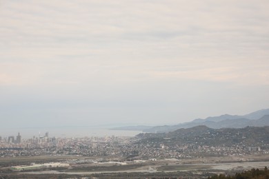 Picturesque view of city, beautiful sea and mountains