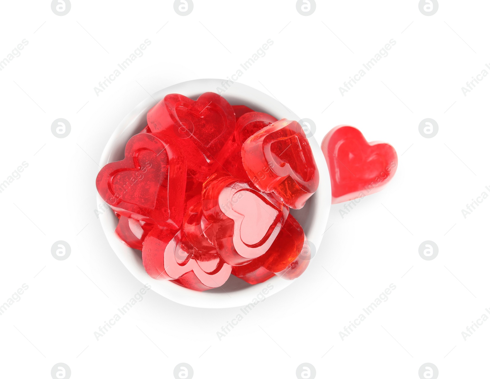 Photo of Sweet heart shaped jelly candies on white background, top view