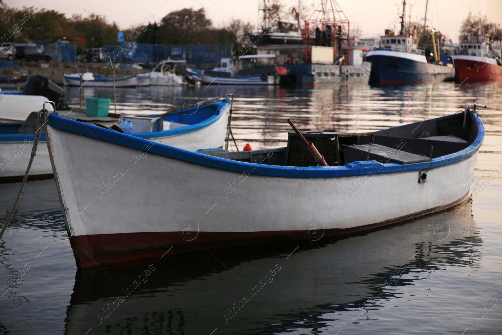 Photo of Beautiful view of river with moored boats at sunset