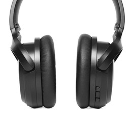 Modern black wireless headphones isolated on white