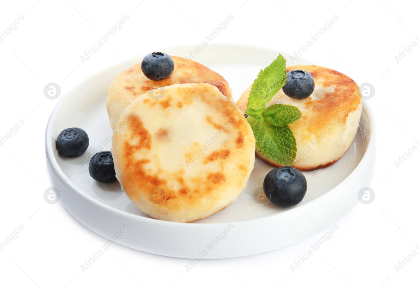 Photo of Delicious cottage cheese pancakes with blueberries  and mint isolated on white