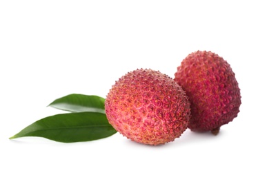 Fresh ripe lychees with green leaves on white background 