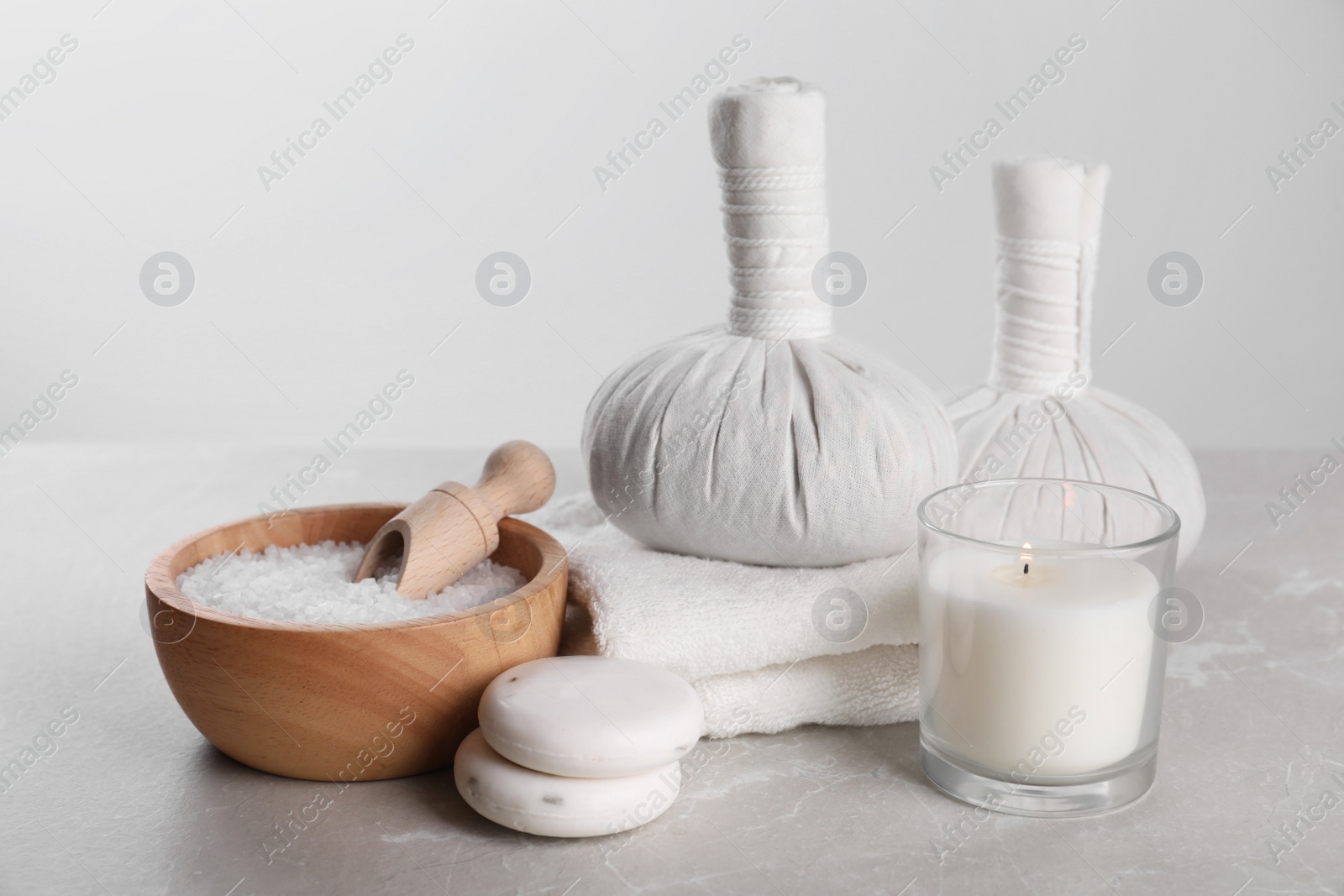 Photo of Spa composition with care products on light grey marble table