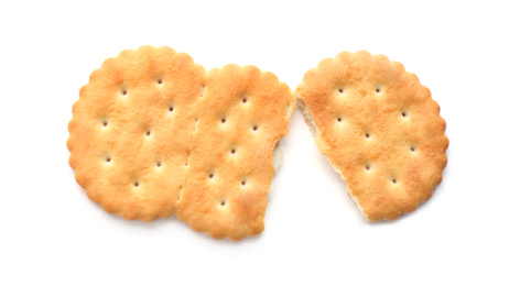 Broken delicious crispy cracker isolated on white, top view