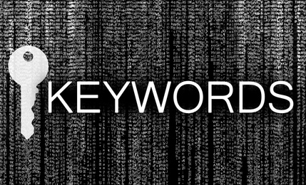 Image of Word Keywords, key and digital code on black background. SEO direction