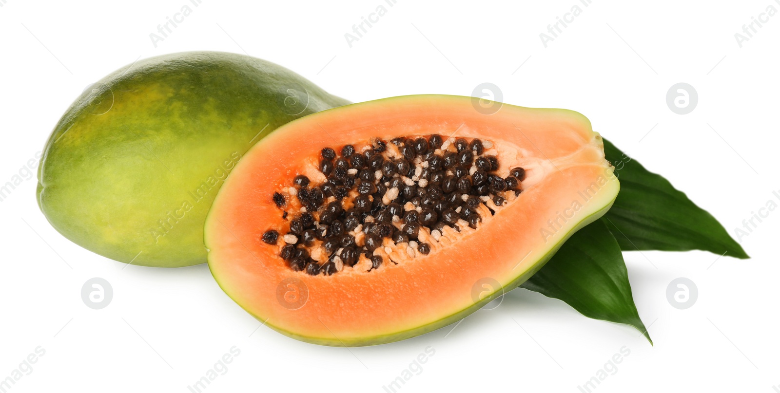 Photo of Fresh ripe papaya fruits with green leaves on white background