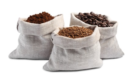 Bags with different types of coffee on white background