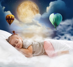 Image of Cute little girl sleeping in bed. Full moon and hot air balloons in cloudy sky - sweet dreams