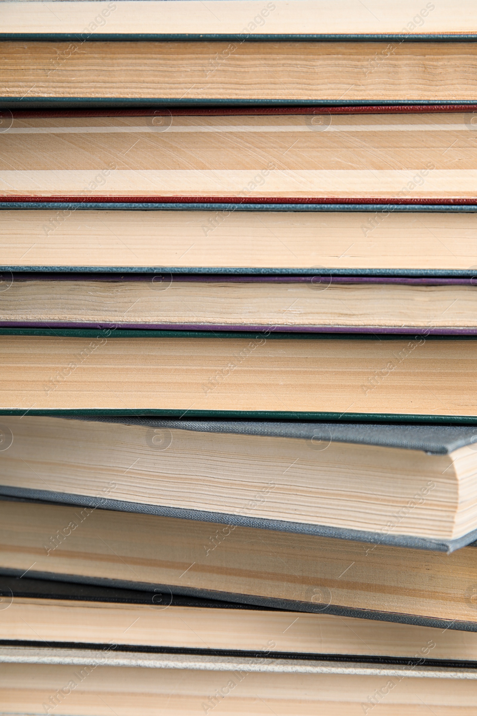 Photo of Stack of hardcover books as background, closeup