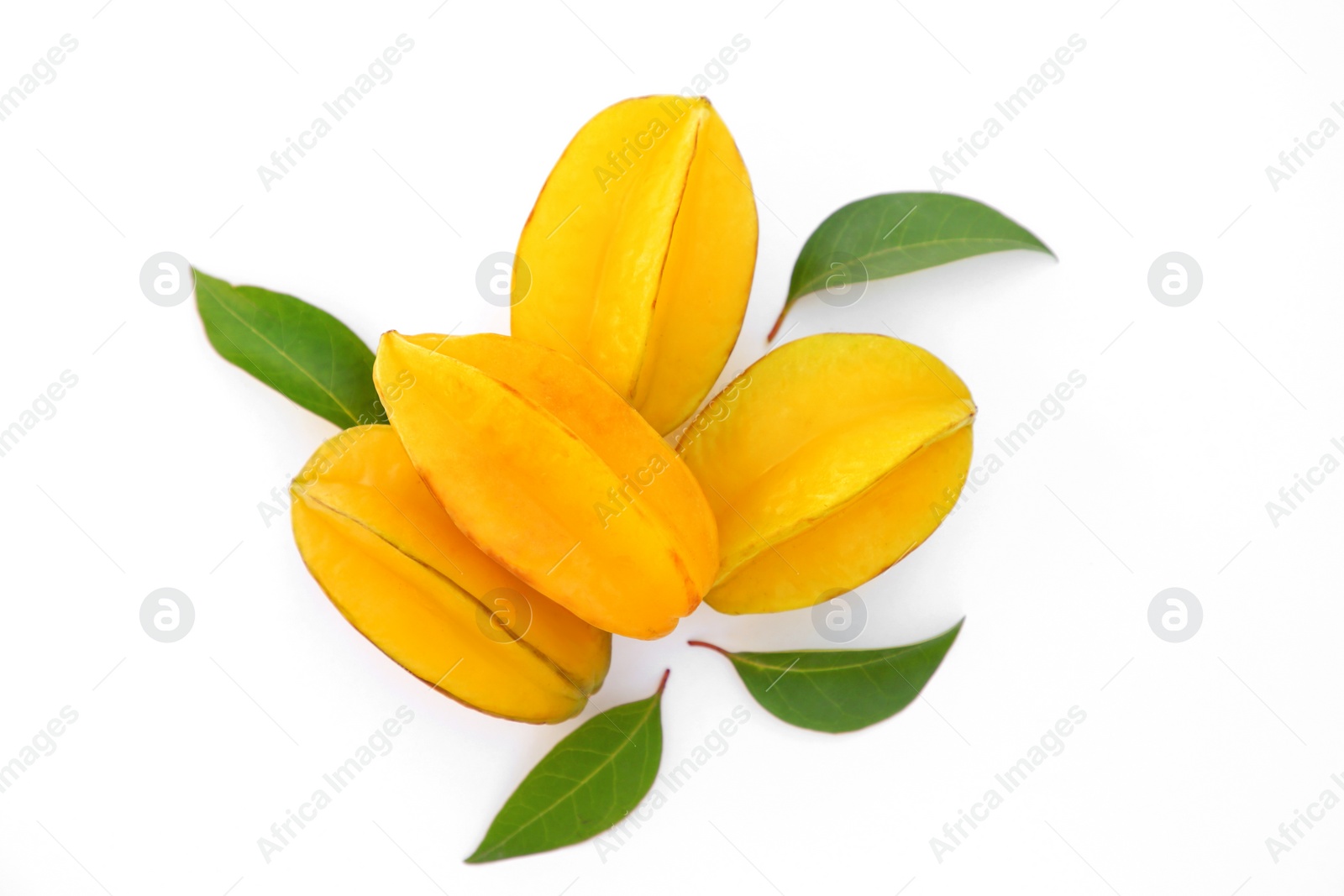 Photo of Delicious ripe carambolas with green leaves on white background, top view