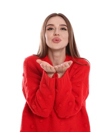 Beautiful young woman in red sweater on white background. Winter season