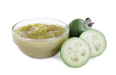 Photo of Feijoa jam in glass bowl and fresh fruits on white background