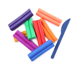 Photo of Many different colorful plasticine pieces and sculpting knife on white background, top view