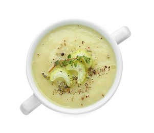 Photo of Bowl of delicious celery soup isolated on white, top view