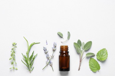 Photo of Bottle of essential oil, different herbs and flowers on white background, flat lay. Space for text