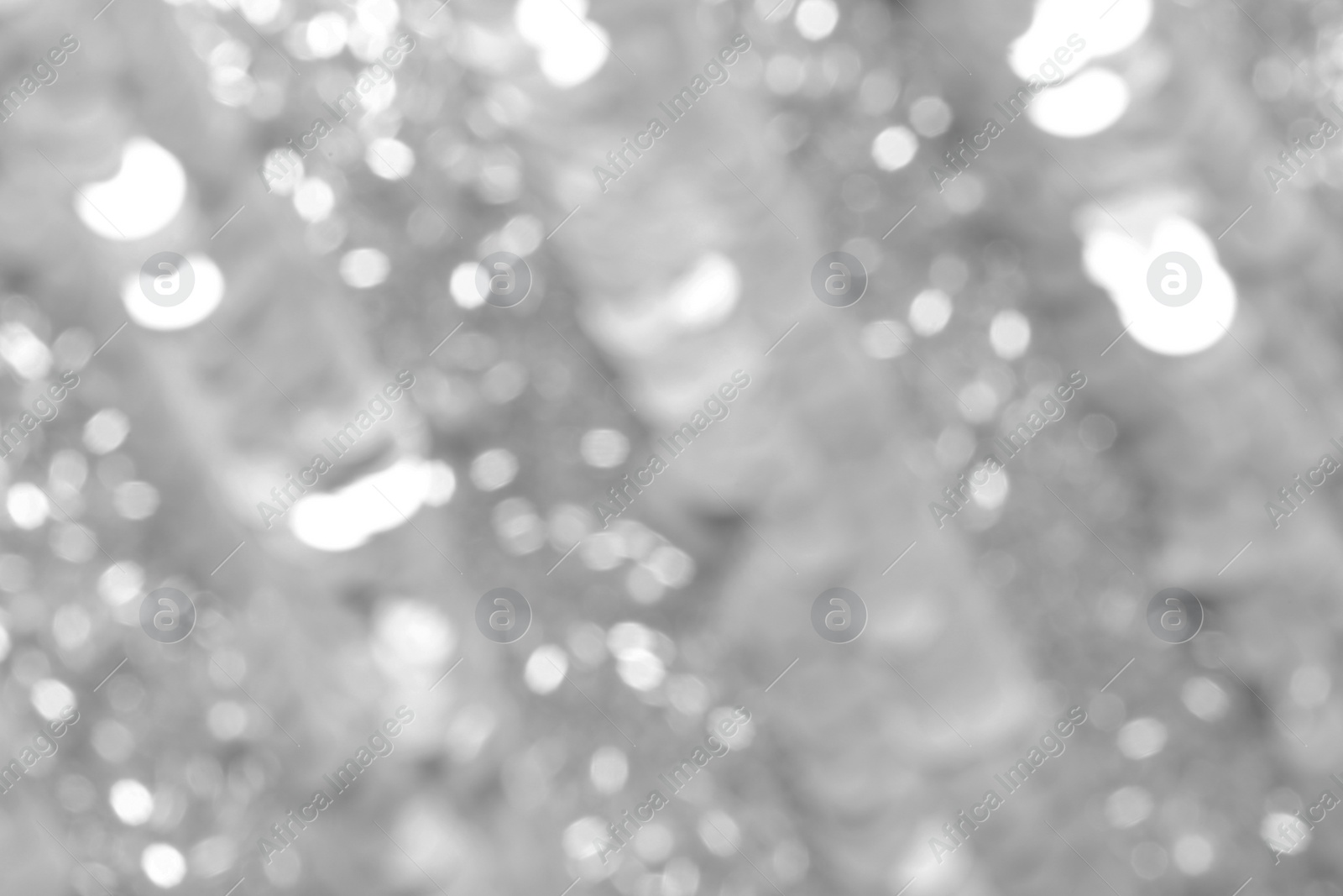 Image of Blurred view of shiny silver surface as background