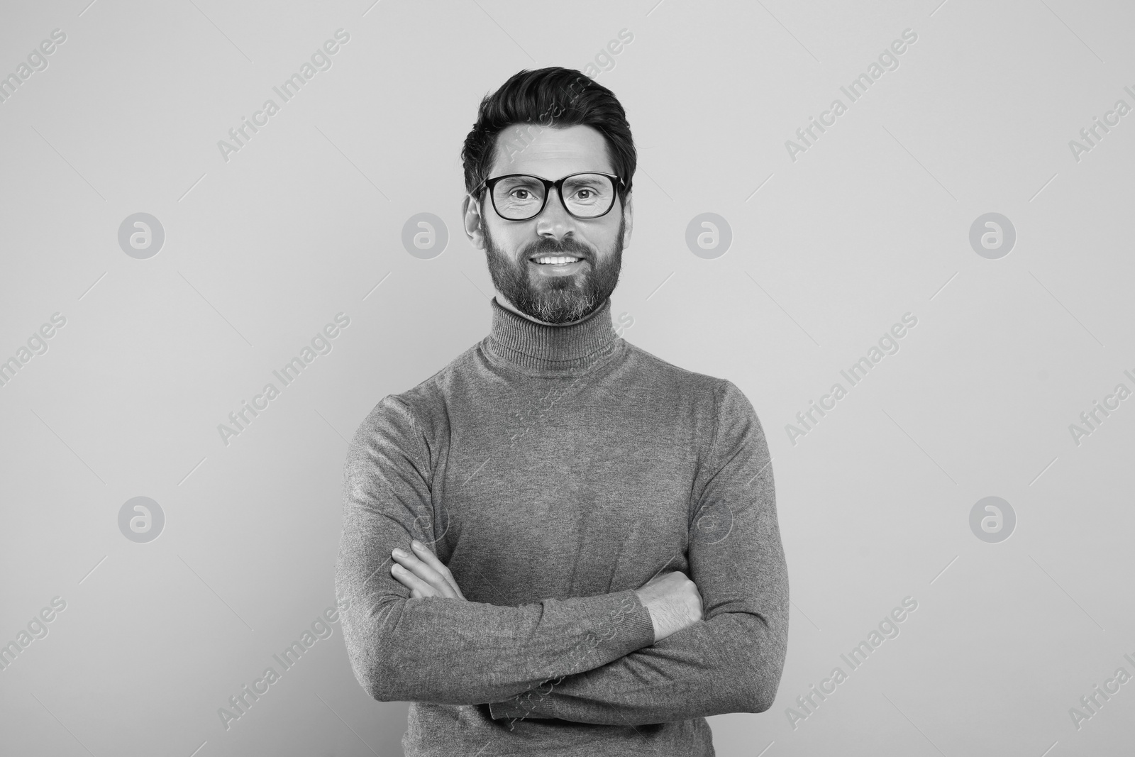 Image of Portrait of handsome man on light background. Black and white effect