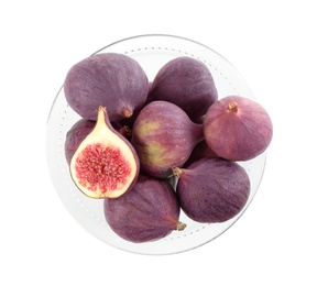 Photo of Whole and cut tasty fresh figs in glass bowl on white background, top view