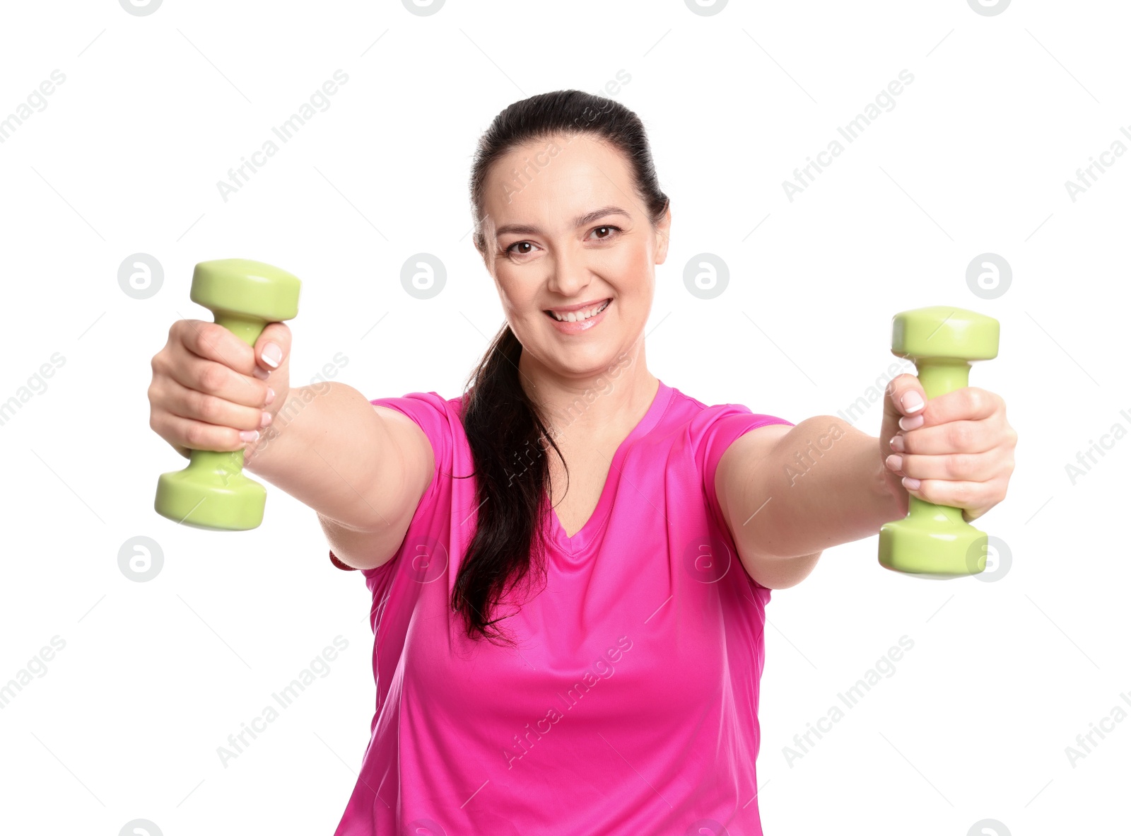 Photo of Happy overweight woman doing exercise with dumbbells on white background