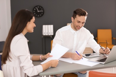 Photo of Human resources manager conducting job interview with applicant in office