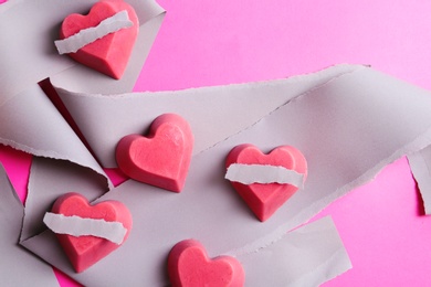 Composition with heart shaped berry ice cubes on color background, flat lay