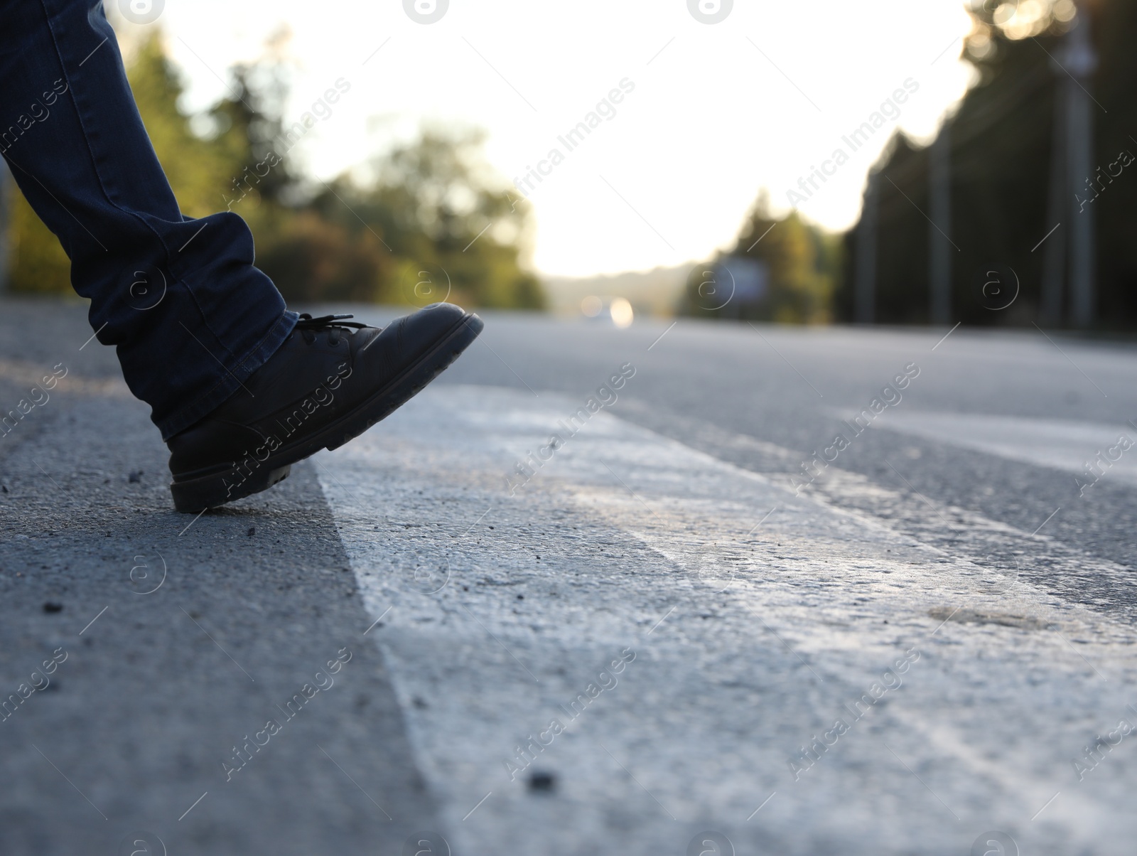 Photo of Man walking on crosswalk, closeup. Space for text