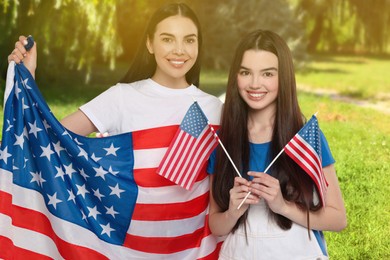 Image of 4th of July - Independence day of America. Happy mother and daughter with national flags of United States in park