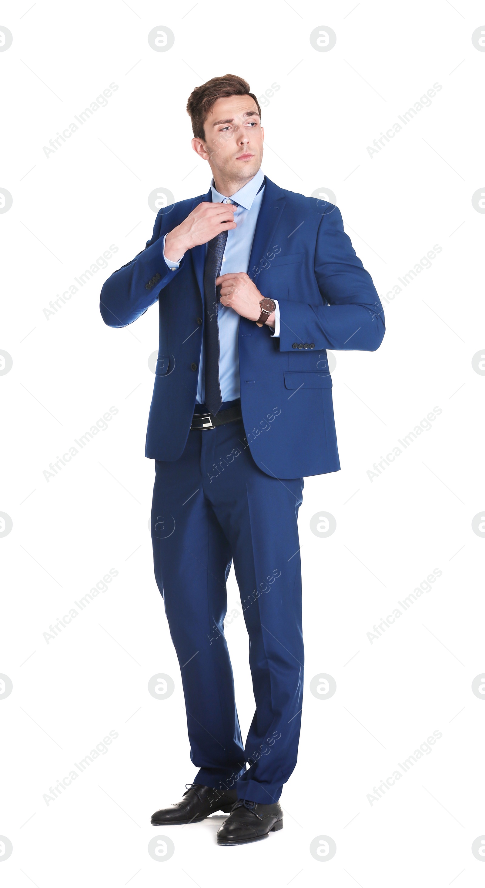 Photo of Handsome young man in suit on white background