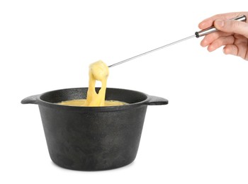 Photo of Woman dipping piece of bread into fondue pot with tasty melted cheese on white background, closeup