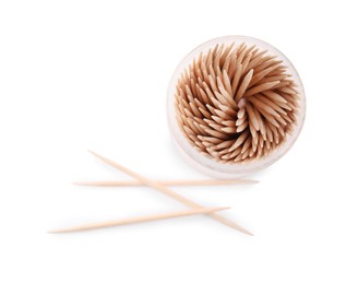 Wooden toothpicks and holder on white background, top view